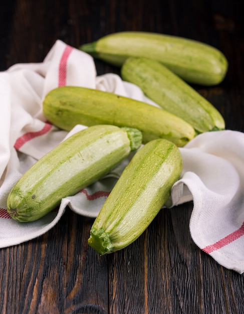 Fresh zucchini on wooden table