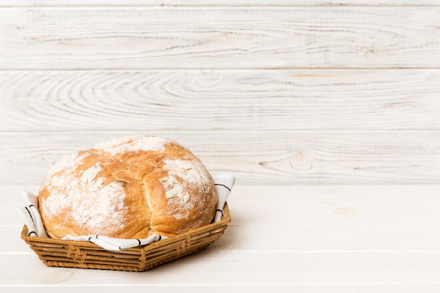 Freshly baked bread on basket against natural background Perspective view bread copy space