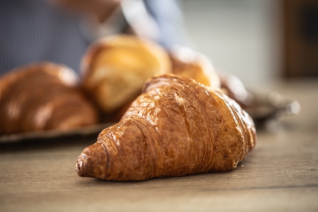 Freshly baked croissant on a table - Close up.