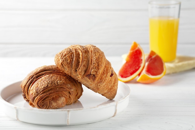 Freshly baked croissants with freshly squeezed orange juice European breakfast