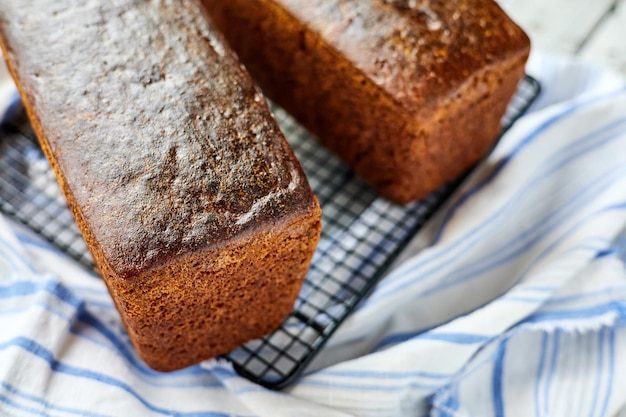 Freshly baked homemade rye bread on a textile background