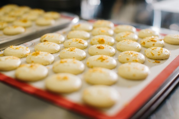 Freshly baked macaroons on a baking sheet