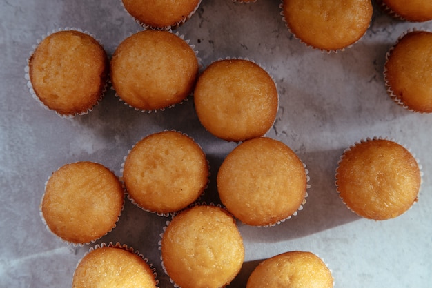 Freshly baked mini muffins on a rustic table