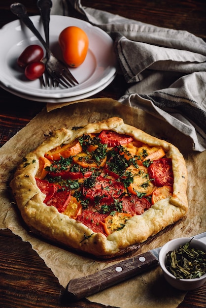 Freshly baked tomato galette on baking paper