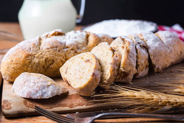 Freshly baked traditional bread on wooden table Oatmeal Bread