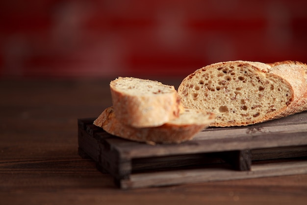 Freshly baked traditional bread on wooden table