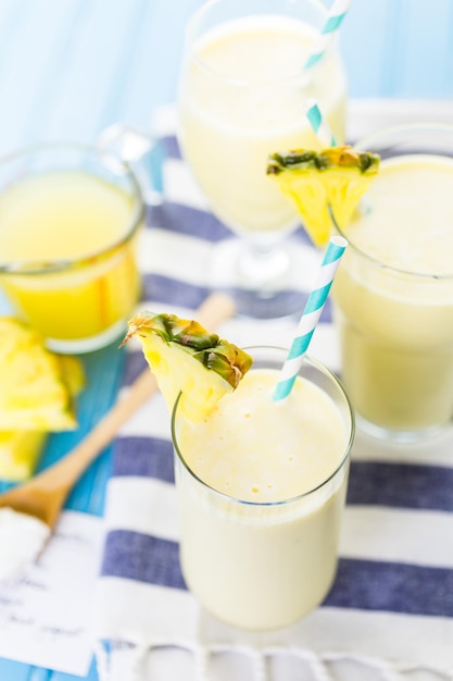 Freshly made pineapple ginger smoothie with Greek yogurt and juice.