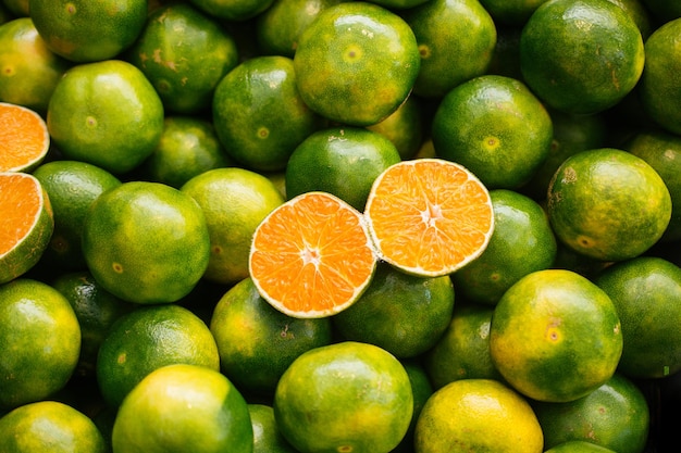 Freshly picked green tangerines mandarines clementines citrus oranges