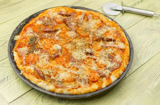 Freshly prepared homemade pizza on a baking dish