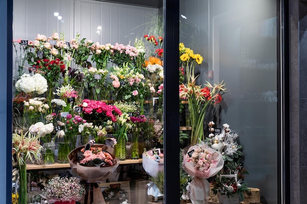 Fridge in premium flower shop with bouquets and stylish flower arrangements