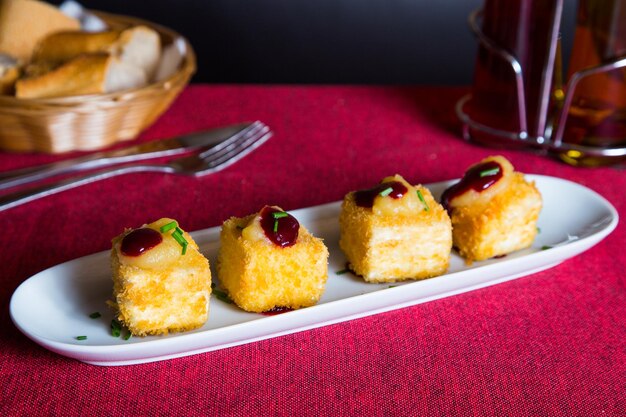 Fried brie cheese with berries jam.