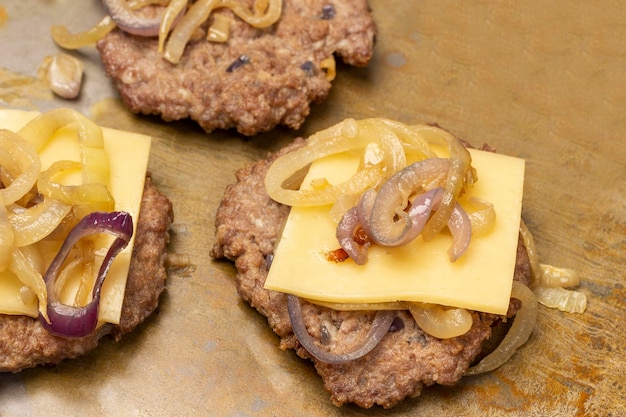 Fried burger with cheese and fried onions