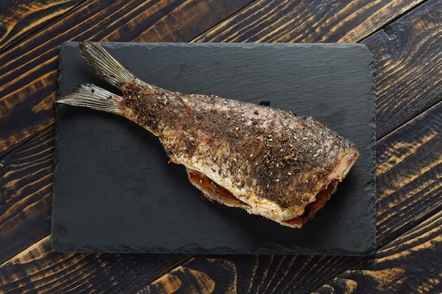 Fried carp fish on the table