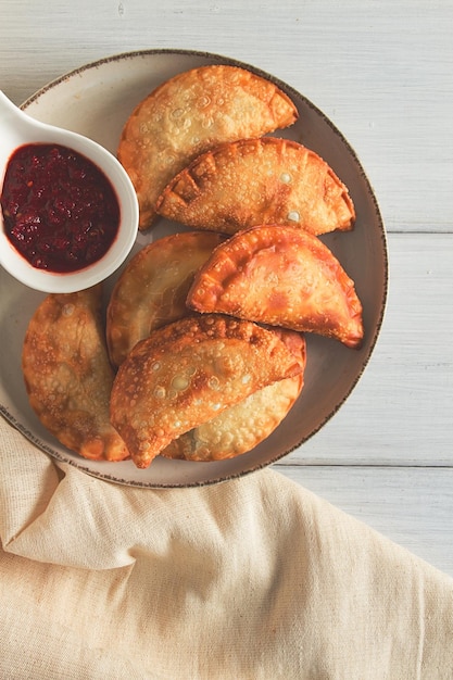 Fried chebureks closeup on a light background no people