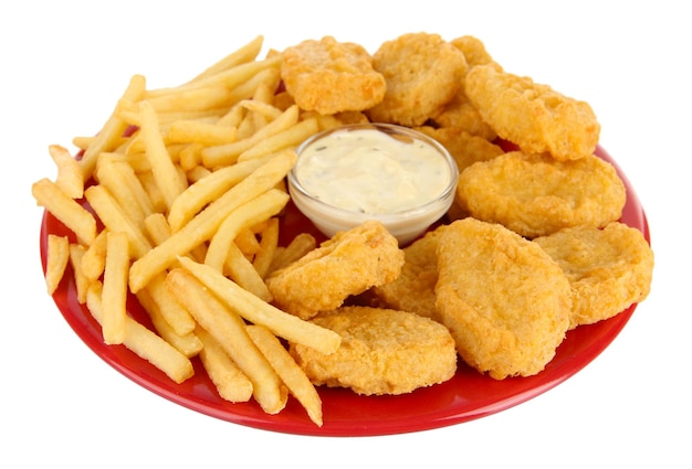 Fried chicken nuggets with french fries and sauce isolated on white