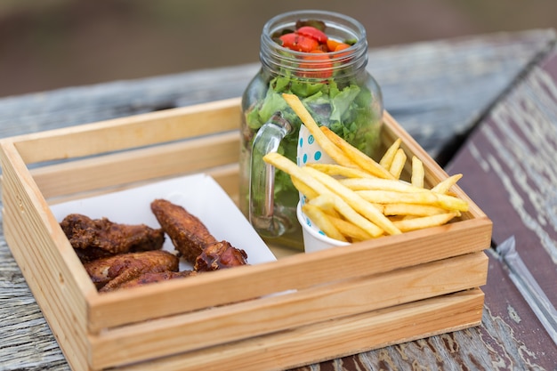 Fried chicken on the old wooden table.