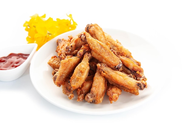 Fried chicken on white ceramic plate Food concept