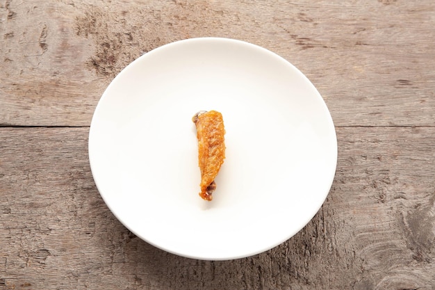 Fried chicken on white ceramic plate Food concept