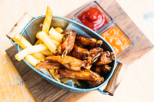 Fried chicken wings with french fries