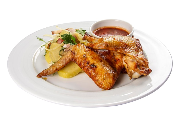 Fried chicken wings with potatoes on a white background