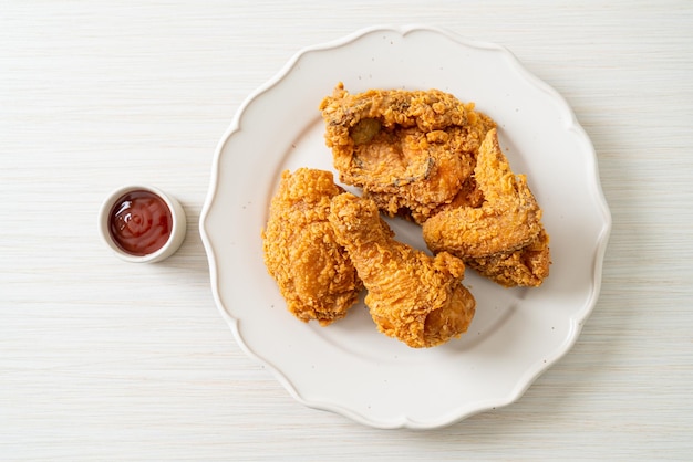 fried chicken with ketchup on plate