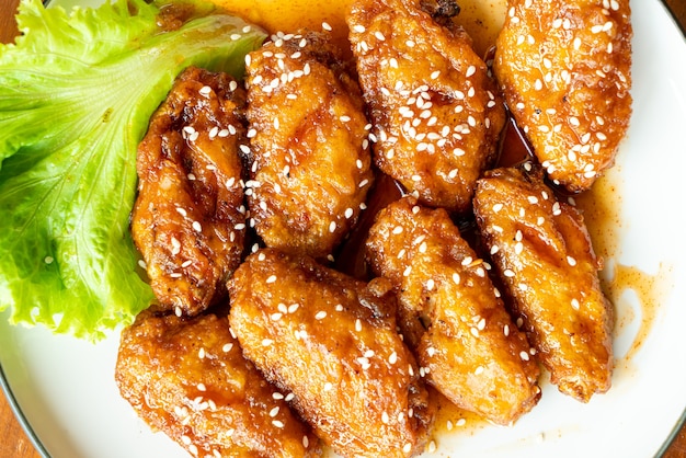 fried chicken with Korean spicy sauce and white sesame