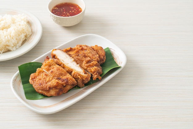 fried chicken with sticky rice and spicy sweet sauce