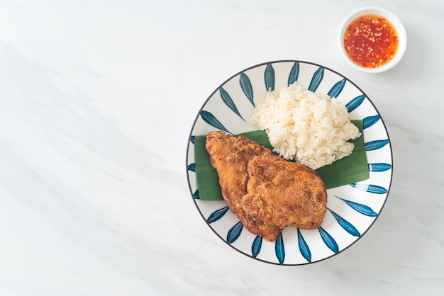 fried chicken with sticky rice and spicy sweet sauce