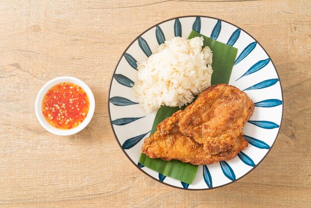 fried chicken with sticky rice and spicy sweet sauce