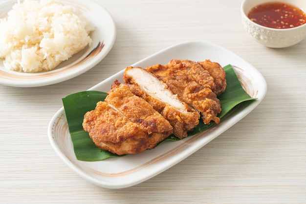 fried chicken with sticky rice and spicy sweet sauce