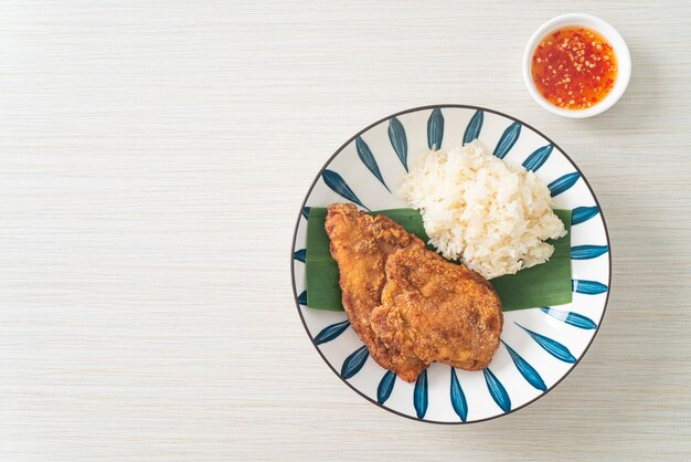 fried chicken with sticky rice and spicy sweet sauce