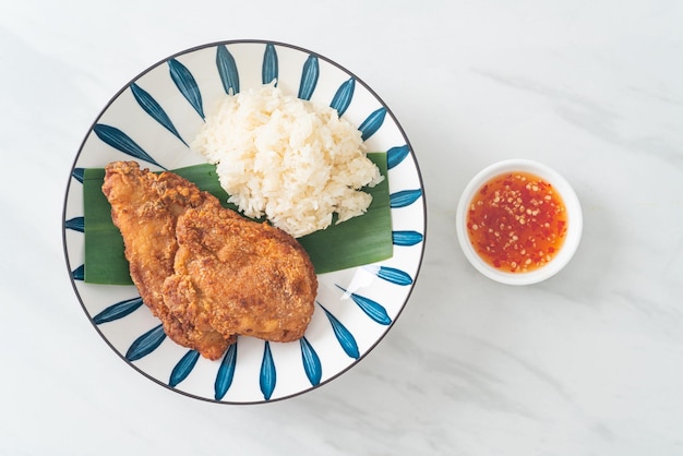 fried chicken with sticky rice and spicy sweet sauce