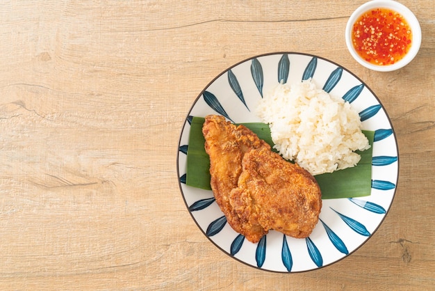 fried chicken with sticky rice and spicy sweet sauce