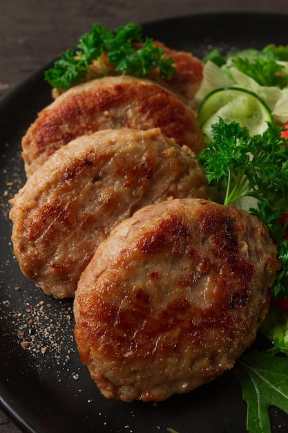 Fried cutlets turkey with vegetable salad top view no people