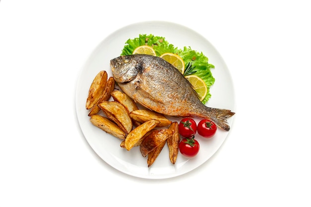 Fried dorado fish with fried potatoes on a white background horizontal no people top view