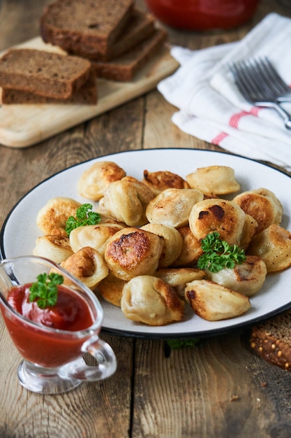 Fried dumplings stuffed with minced meat on a plate