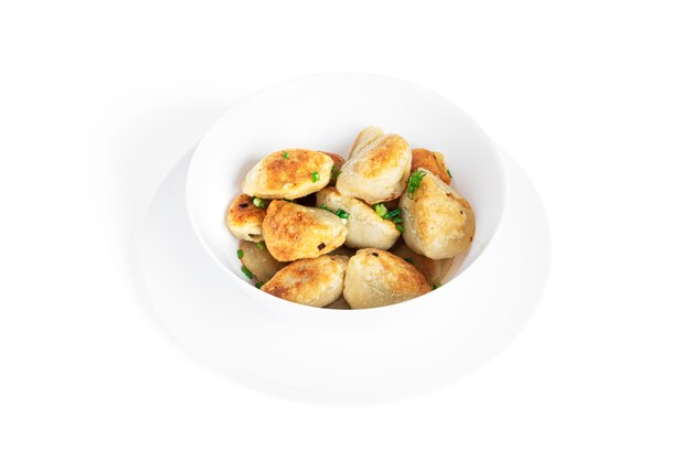 Fried dumplings with potatoes and green onion isolated.