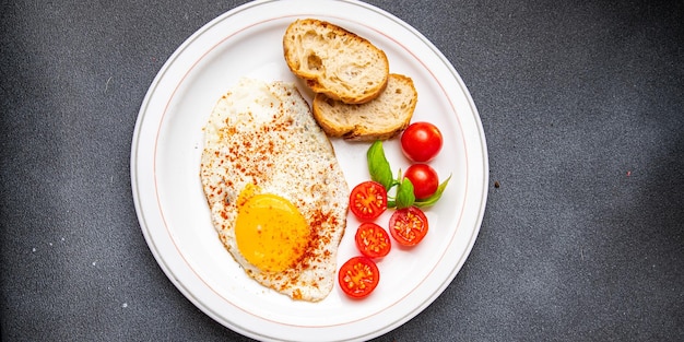 fried egg breakfast food, tomato, healthy meal snack on the table copy space food background