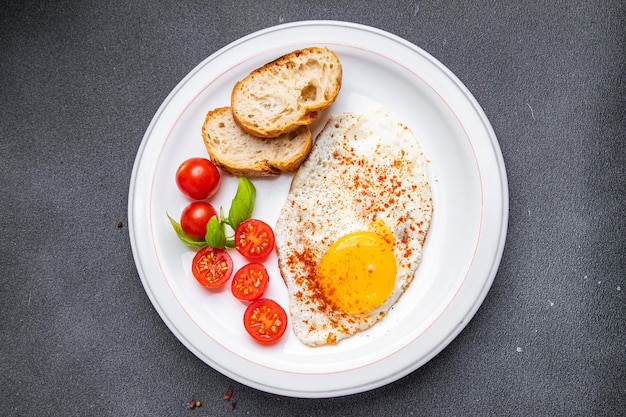 fried egg, tomato, breakfast healthy meal food snack diet on the table copy space food background