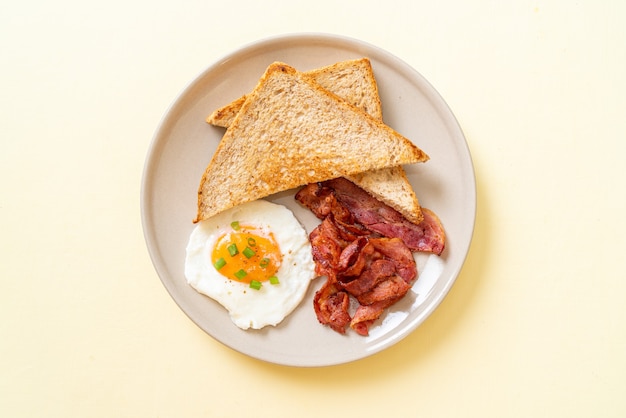 fried egg with toasted bread and bacon