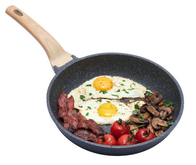 Fried eggs and bacon on a frying pan isolated on white background