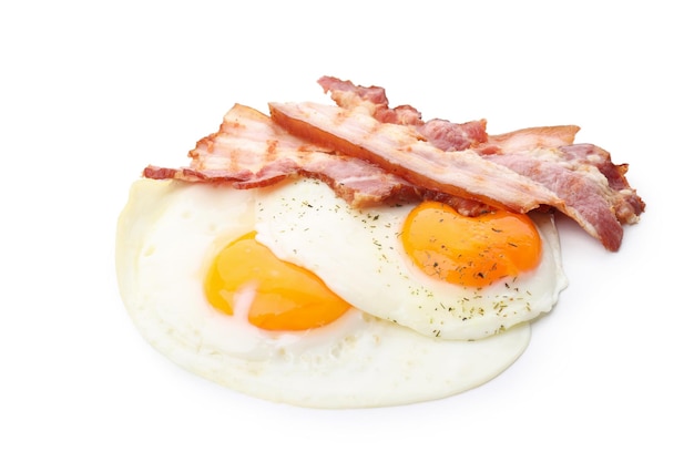 Fried eggs and bacon isolated on white background