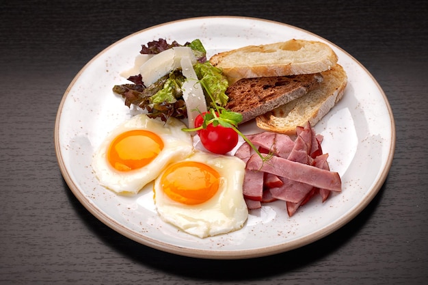 Fried eggs with ham cheese and toast