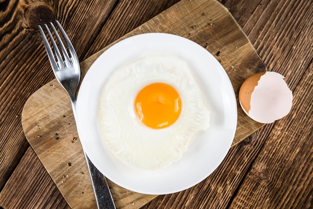 Fried Eggs on wooden background