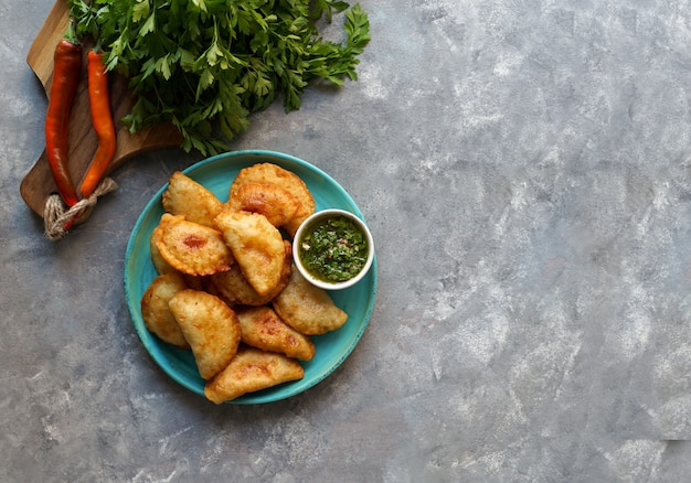 fried empanadas with  sauce. Top view.