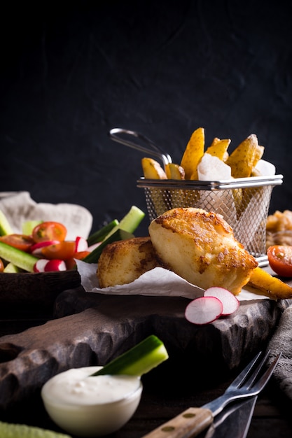 Fried fish fillet with baked potatoes