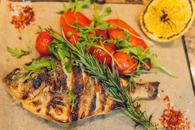 Fried fish with fresh herbs and lemon