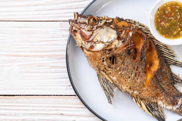 Fried fish with spicy seafood sauce