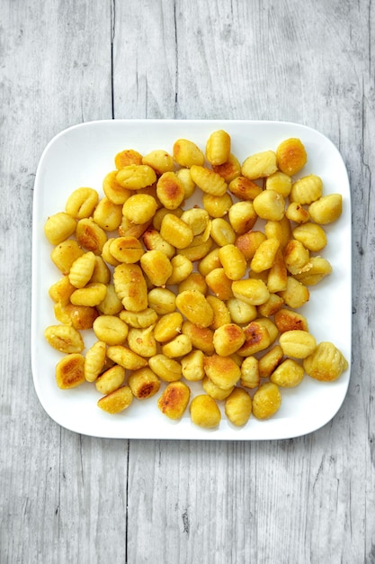 Fried garlic gnocchi in butter