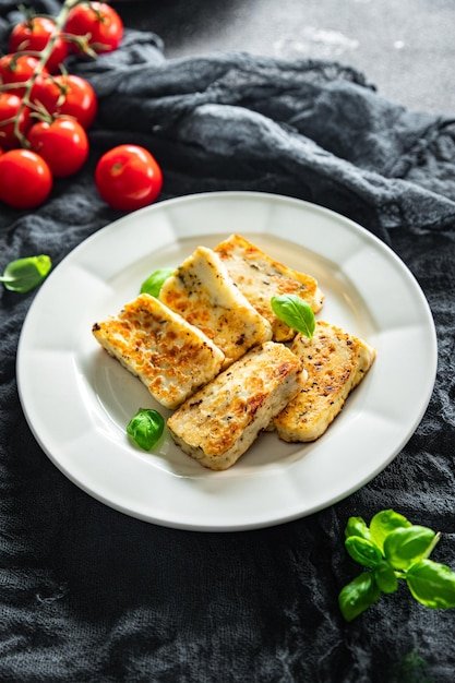 fried halloumi cheese with basil healthy meal food snack on the table copy space food background